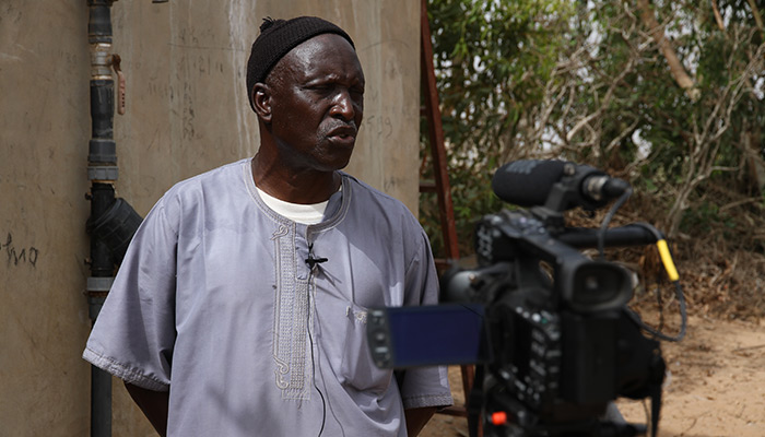 Doudou Diop is a farmer. He got a wind turbine to pump water and irrigate his crops. 